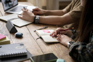 two-friends-searching-laptop-information-study-session